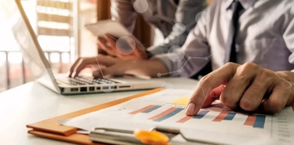 Man checking statistics in a notebook