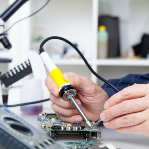 Man using a soldering iron