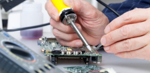 Man using a soldering iron